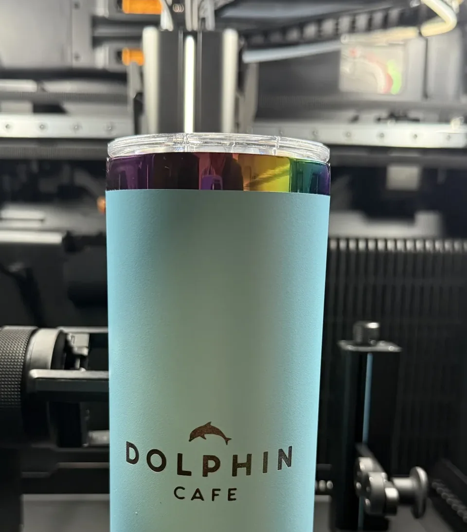 Personalized hospitality tumbler prepared through a rotary engraving workflow