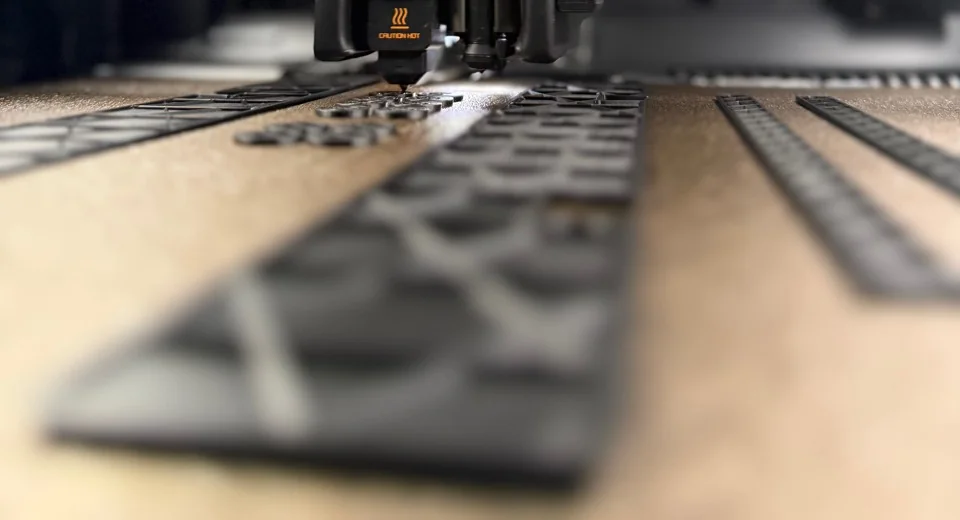 A detailed production toolpath being reviewed during an internal process study