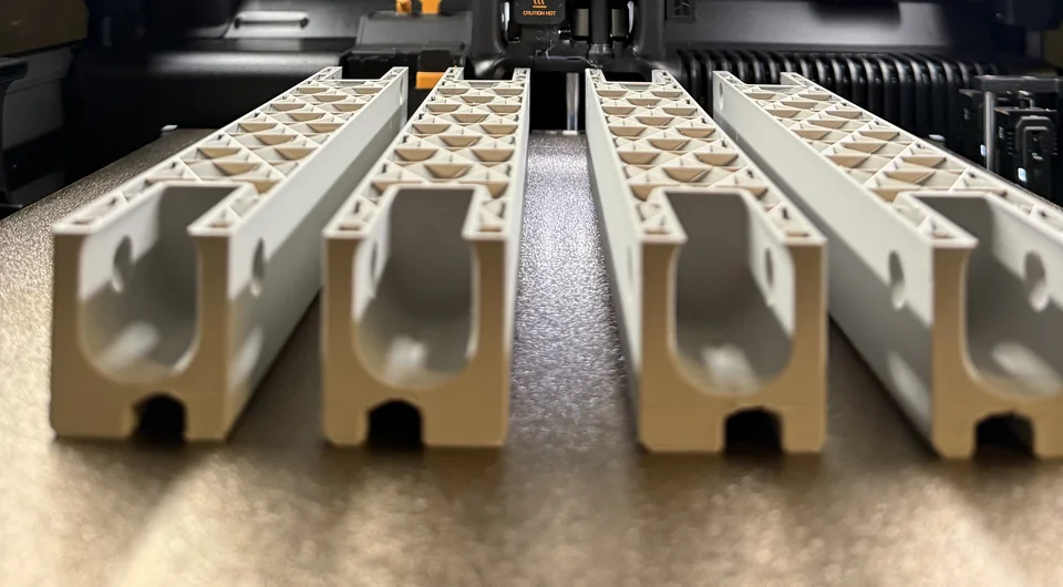 Four matching structural components arranged as a BAUMS production study